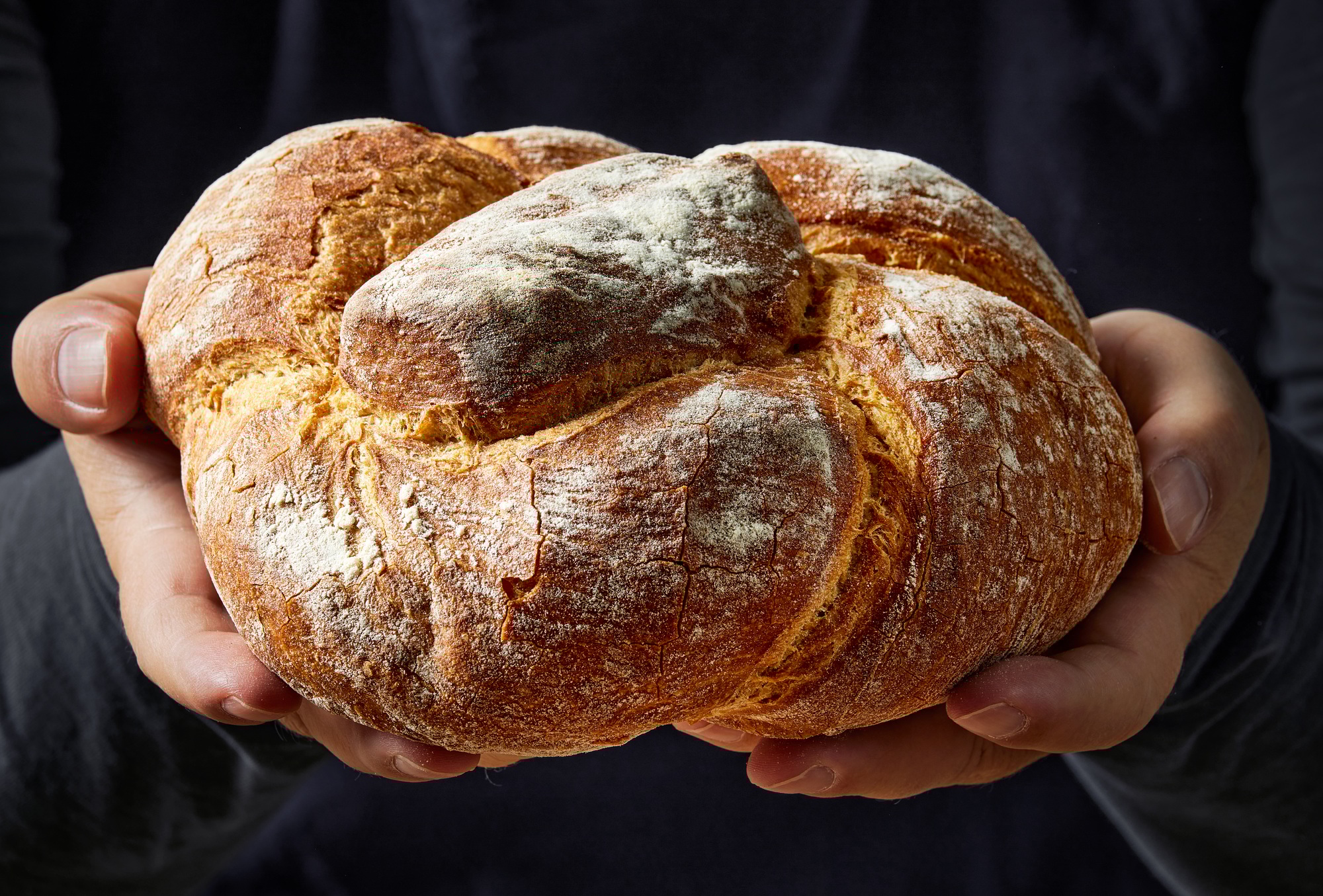 freshly baked bread in hands
